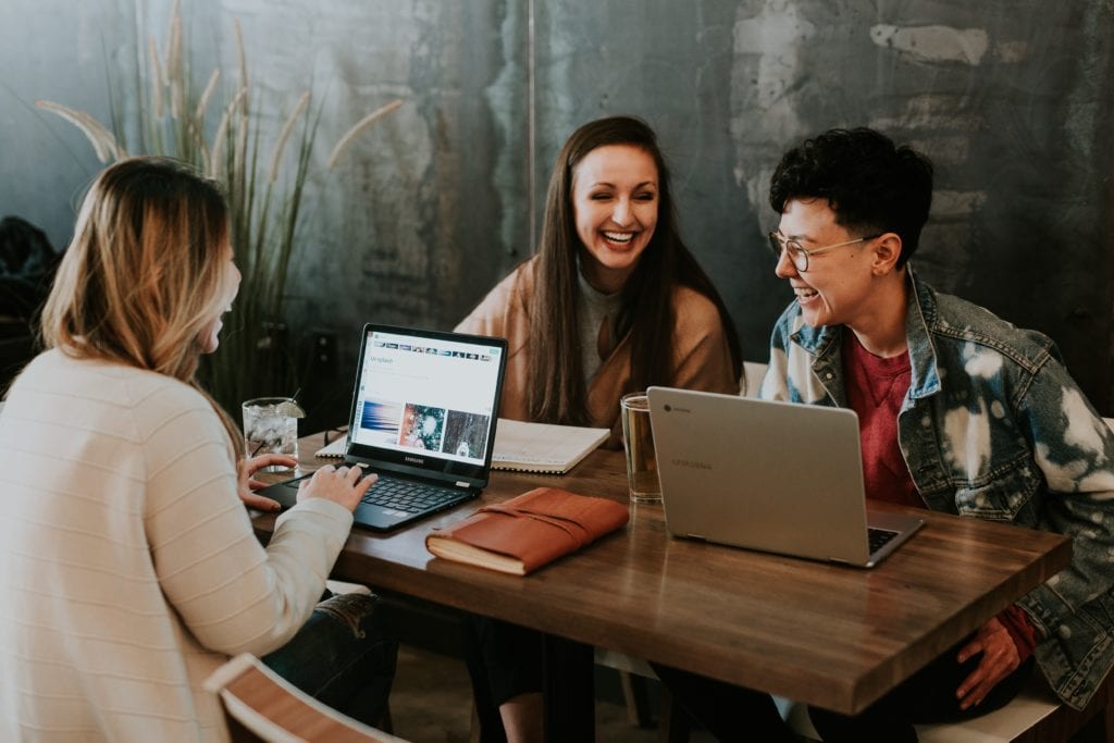 Background image of some students smiling